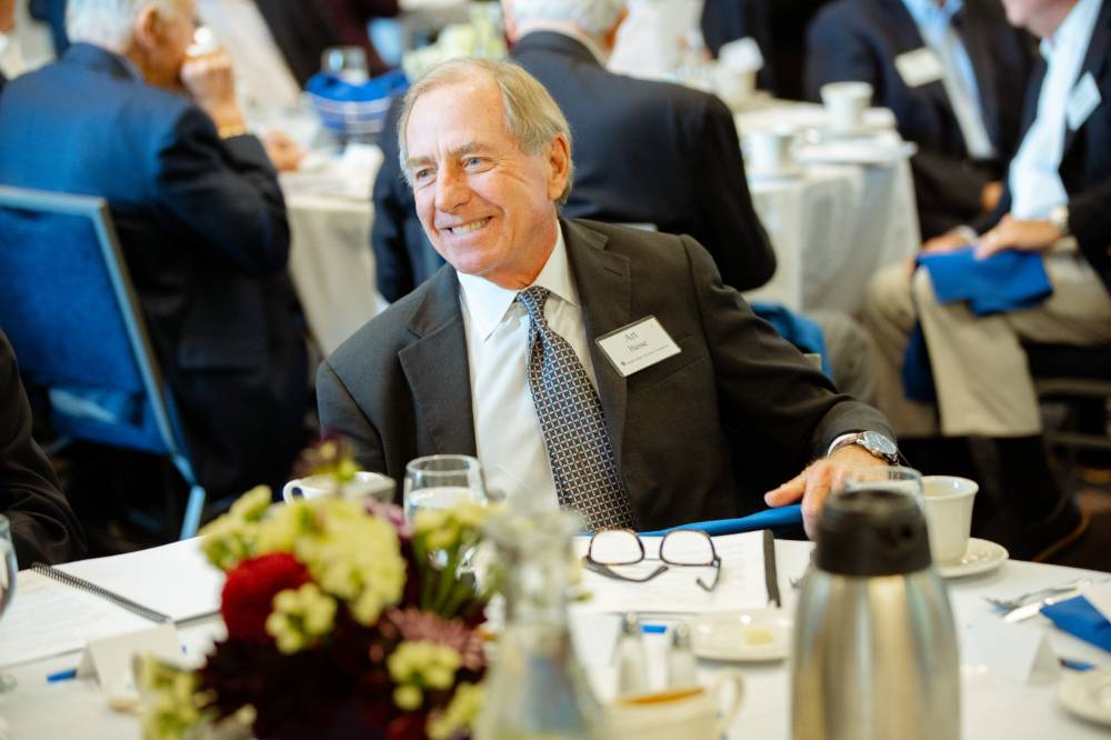 Guest sitting at a table at the Foundation Annual Meeting